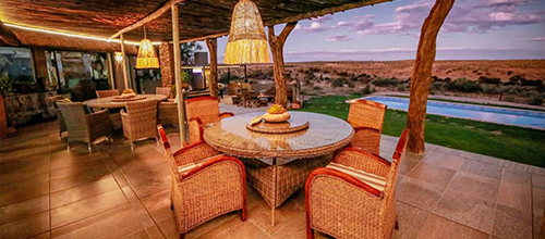 Stay at our luxurious Hemingway Lodge at Rhino Sanctuary Namibia and wake up to the sight of wild white rhinos roaming past your terrace. Explore luxury and nature in perfect harmony.